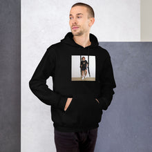 The Volleyer black hoodie worn by a model -- tennis court style