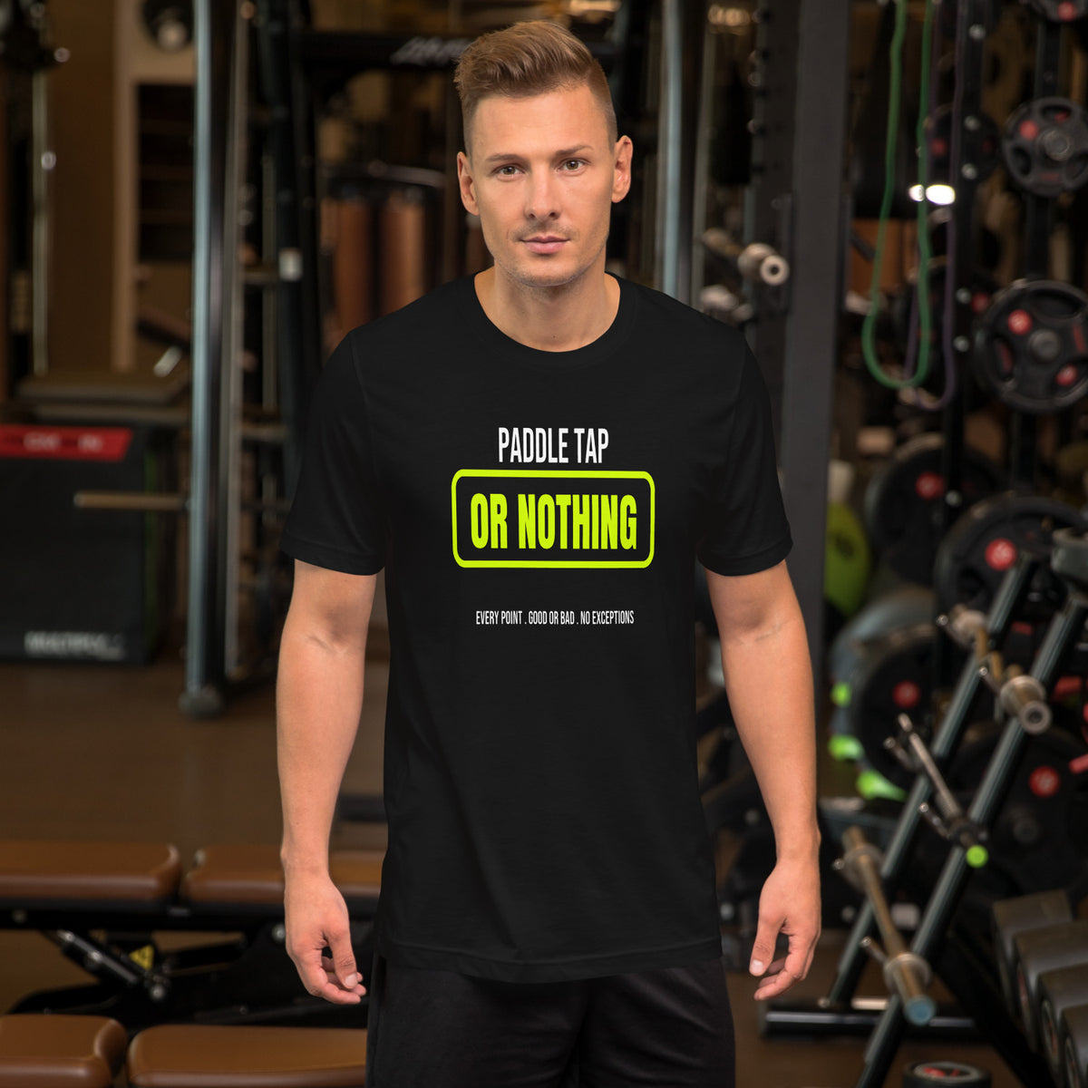 Paddle Tap Or Nothing black unisex t-shirt worn by a model -- pickleball court style