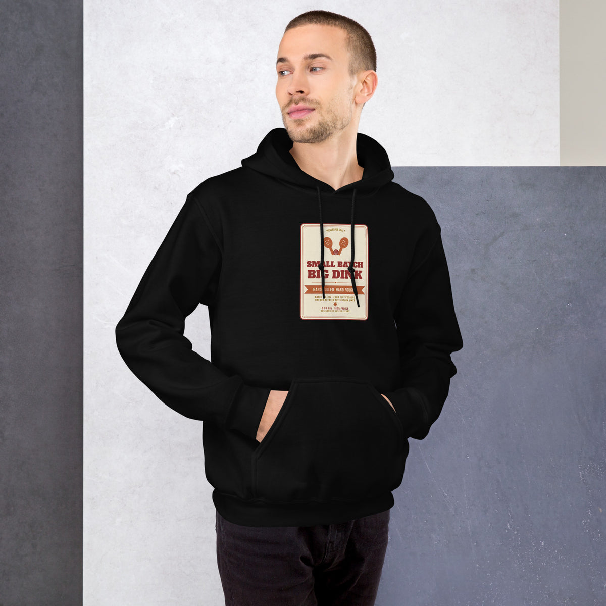 Pickleball Craft black hoodie worn by a model -- pickleball court style