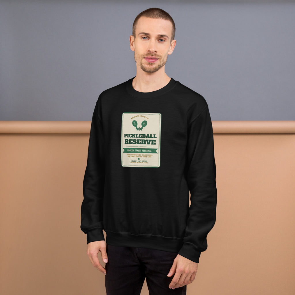 Pickleball Reserve black sweatshirt worn by a model -- pickleball court style